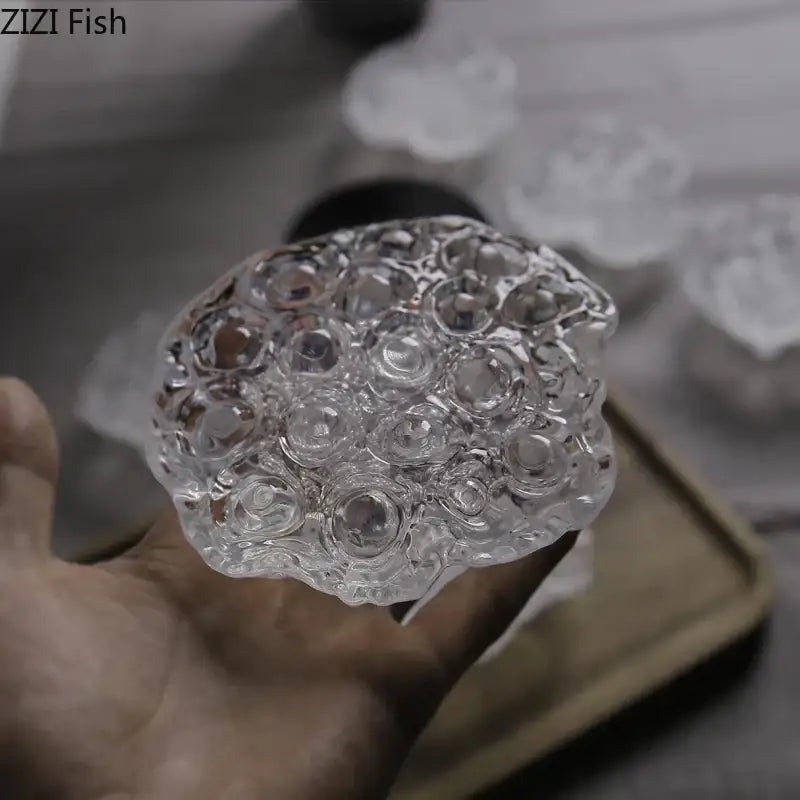 Clear glass lotus seedpod resin sculpture by decorbites featuring intricate bubble textures for modern desk decor
