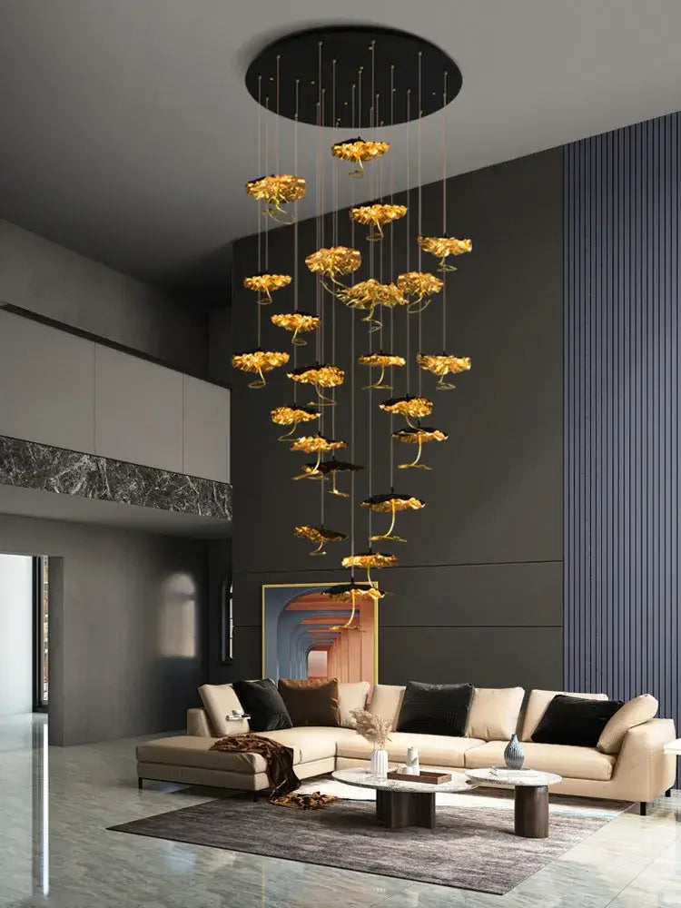 Golden flower-shaped pendant chandelier with sleek black circular ceiling mount from decorbites lotus staircase series
