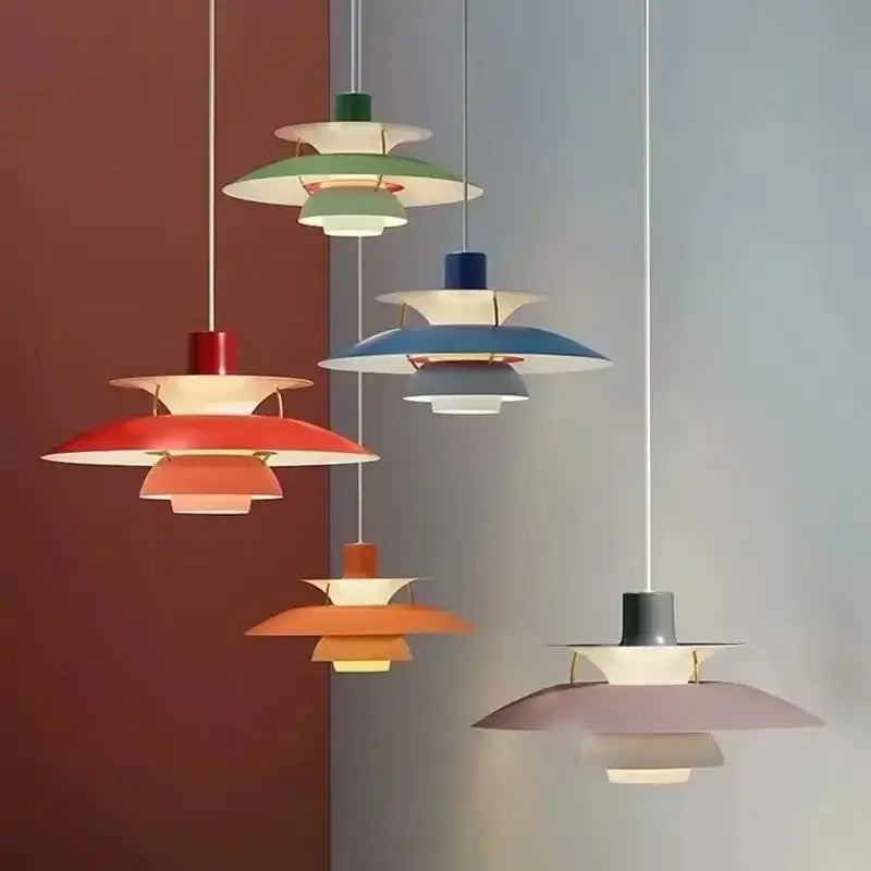 A collection of DecorBites™ Loui LED pendant lights in vibrant multi-tiered shades for modern kitchen and living room decor