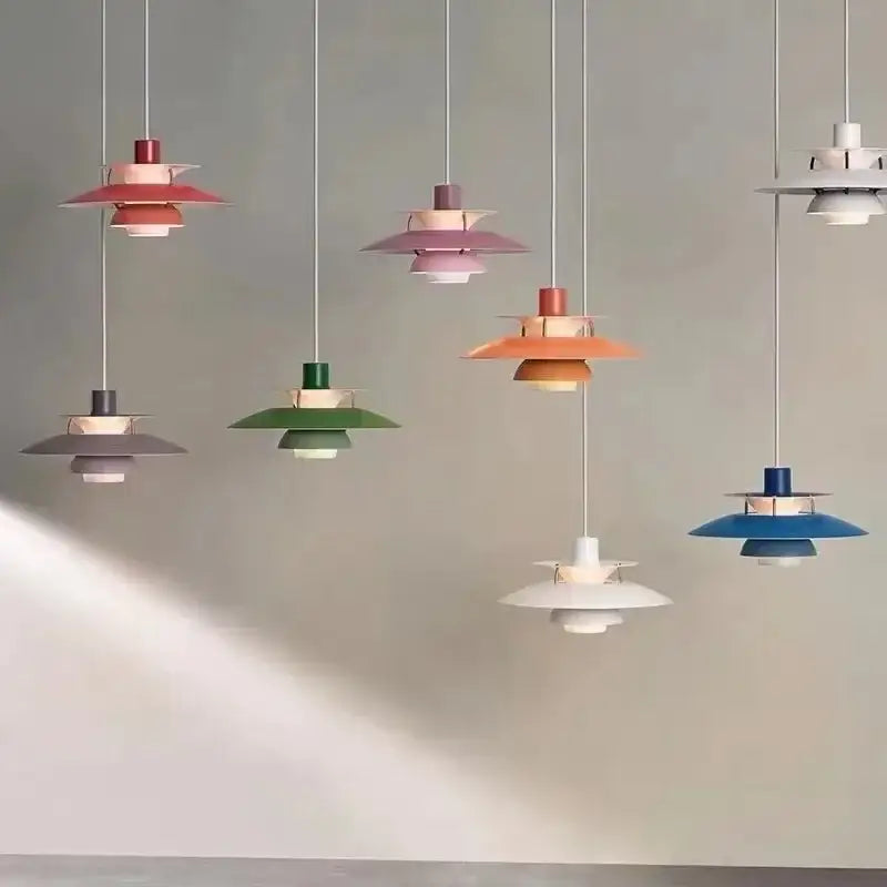 A collection of colorful loui led pendant light fixtures in pastel and vibrant hues for kitchen and living room decor