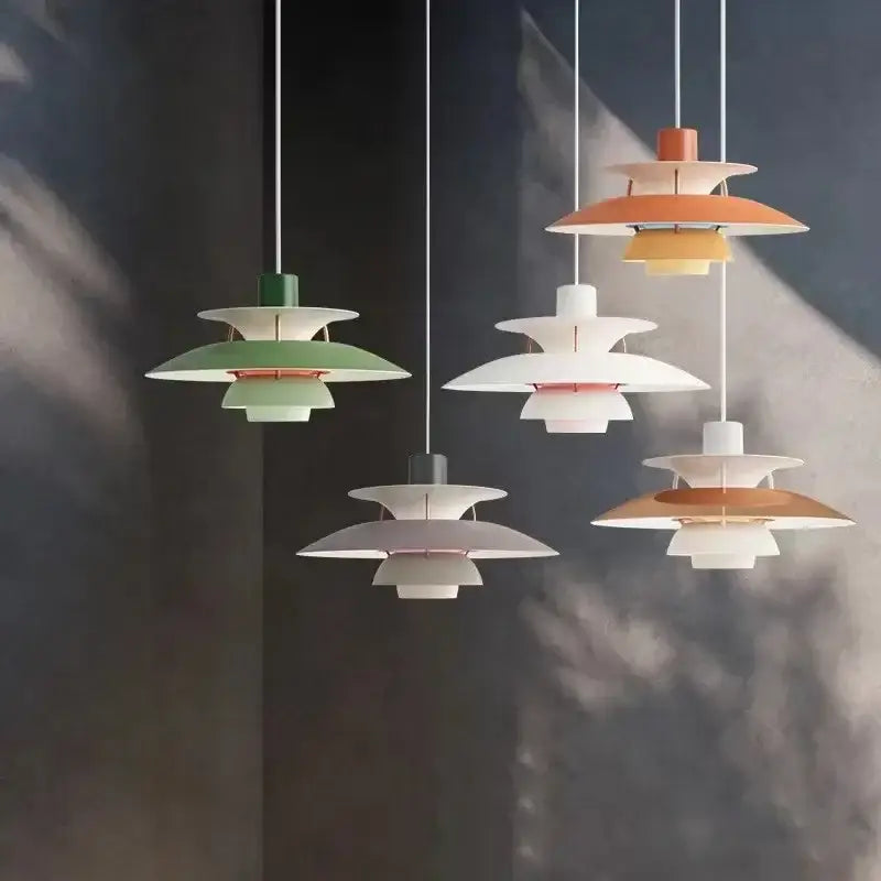 Modern multi-tiered loui led pendant light in pastel green white and terracotta with metallic accents for kitchen or living room