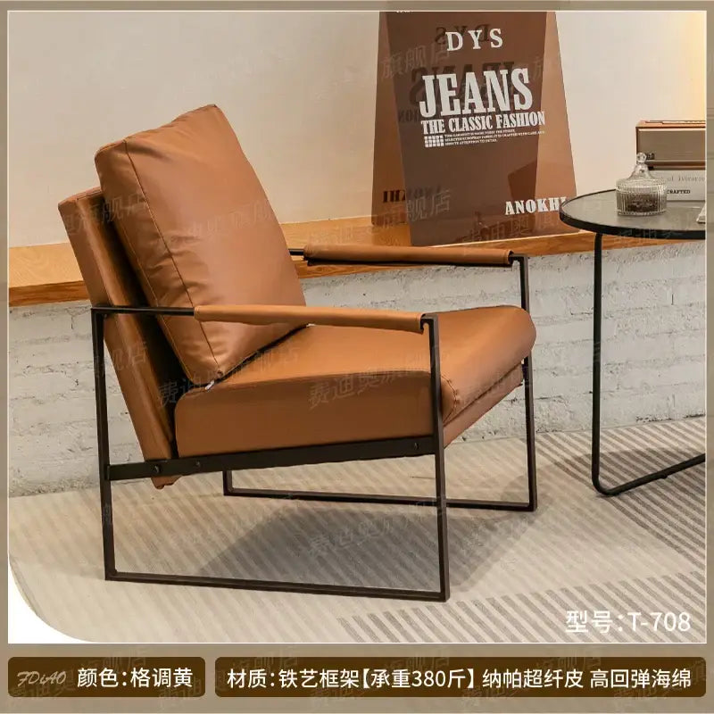 Tan leather single sofa chair with black metal frame decorbites lounge for coffee shop hotel balcony reception area