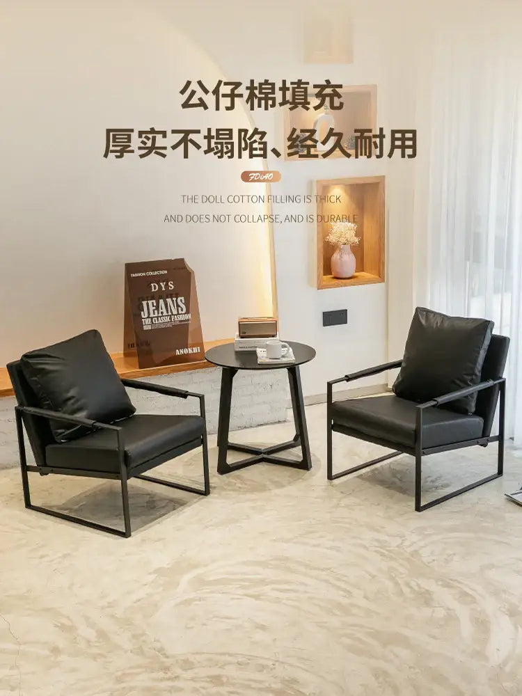 Decorbites™ lounge single sofa chair in black leather with sleek metal frame for coffee shop and reception areas