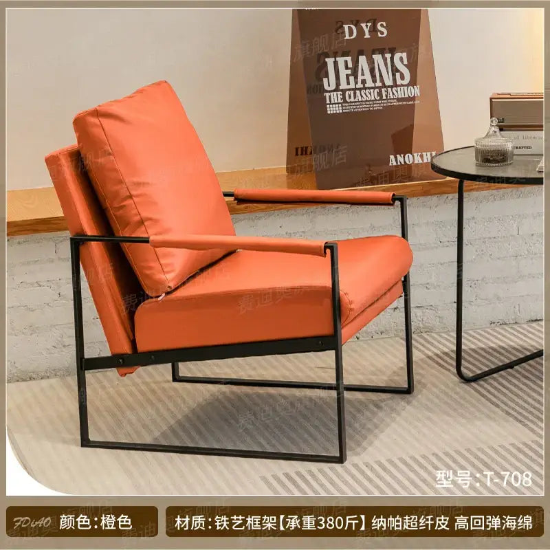 Decorbites™ lounge single sofa chair in orange leather with black metal frame ideal for coffee shop and reception areas