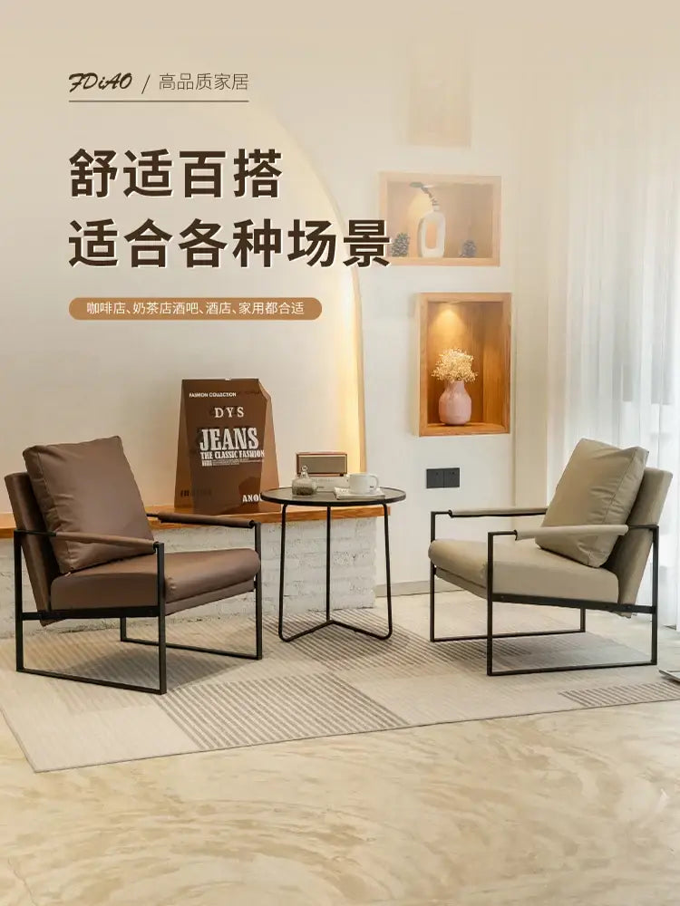 Modern brown leather single sofa chair with black metal frame for coffee shop hotel balcony or reception area use