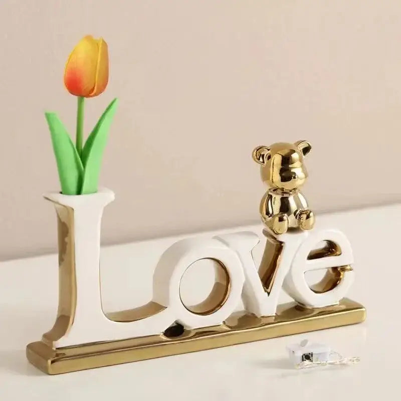 White and gold DecorBites love bear 3D ceramic Christmas decoration featuring a golden bear figurine on top