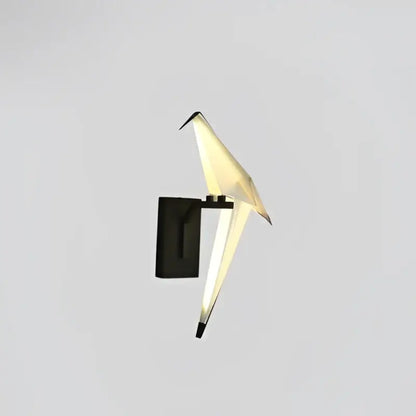 DecorBites™ Love Bird led wall sconce with black iron base and translucent white acryl wings emitting warm glow