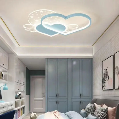 A modern decorbites love ceiling lamp with two interlocking blue heart shapes and starry cloud LED accents for kids room