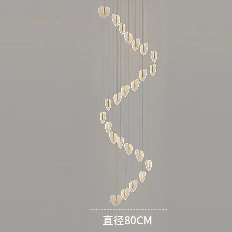 A modern decorbites love chandelier with translucent white heart-shaped crystals and gold accents for living rooms and staircases