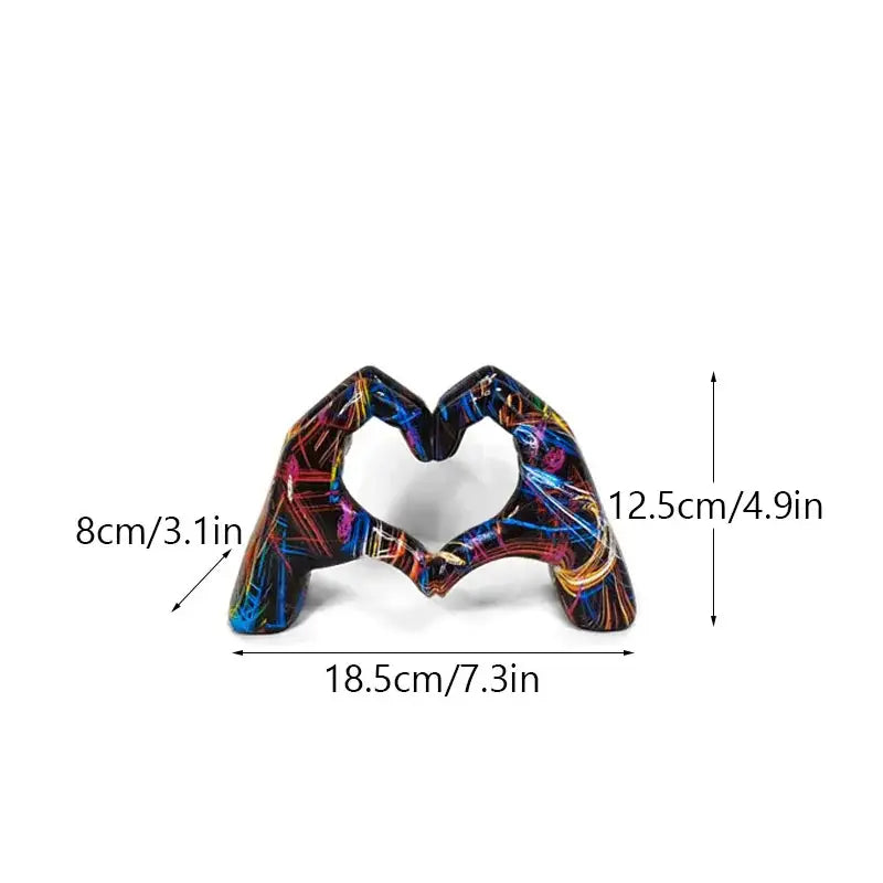 Vibrant abstractly painted resin love gesture sculptures of two hands forming a heart shape by DecorBites™