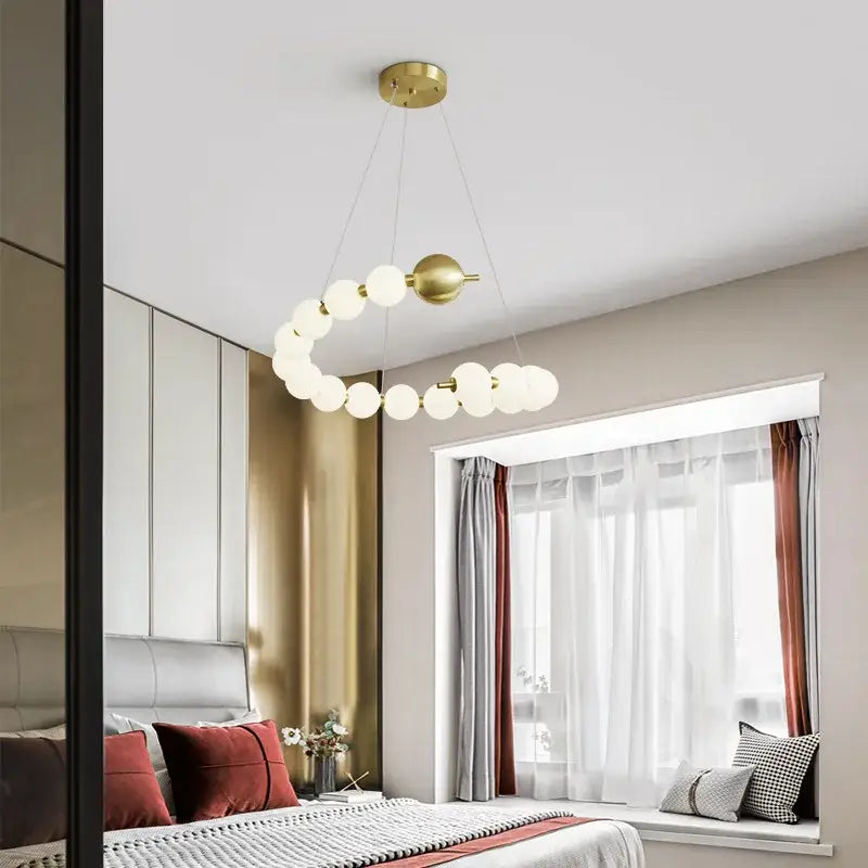 Gold-toned circular pendant light with frosted glass globe bulbs in decorbites love gold chrome chandelier for dining room