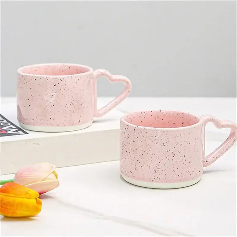 Pink speckled decorbites love handle ceramic mugs with heart-shaped handles and white rims for tea or coffee