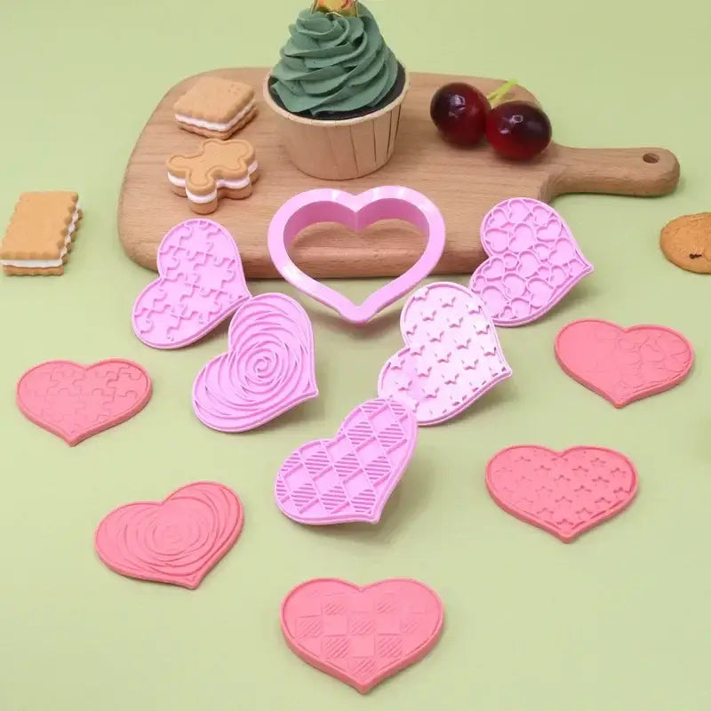 Set of pink heart-shaped biscuit cutters with intricate designs for valentine’s day by decorbites love heart biscuit