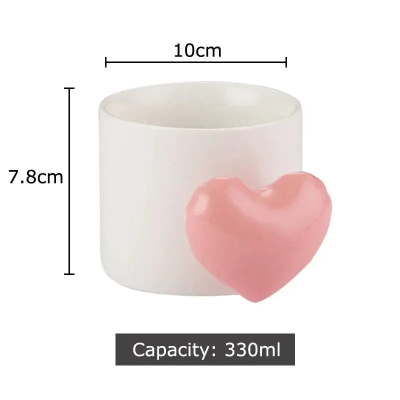 White ceramic mug from DecorBites with a glossy pink love heart ceramic accent for coffee tea or juice