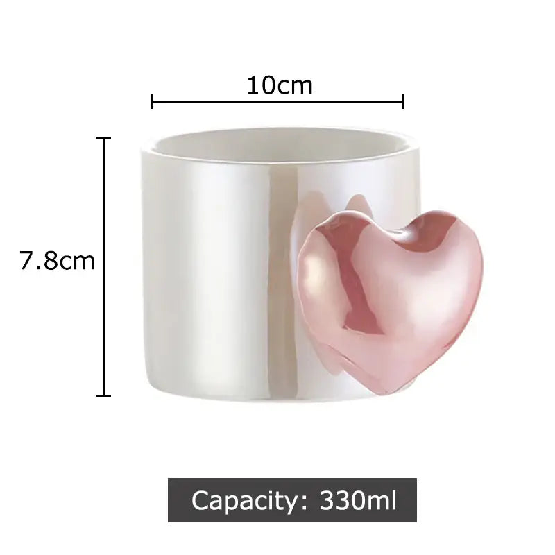 Glossy white ceramic mug with a pink love heart ceramic handle 330ml capacity for coffee tea or juice by DecorBites