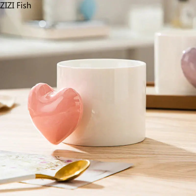 A white ceramic mug with a glossy pink love heart ceramic handle from decorbites dining coffee tea cup collection