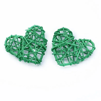 Two green woven heart-shaped decorbites love heart decorations made from natural twine for wedding and valentine use