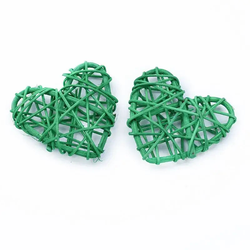 Two green woven heart-shaped decorbites love heart decorations made from natural twine for wedding and valentine use