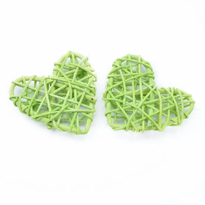 Two light green woven decorbites love heart decorations made from natural twine for wedding and valentines use