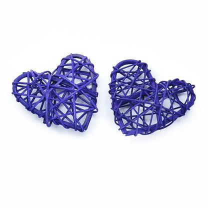 Two intricately woven purple heart-shaped love heart decorations made from natural twine by decorbites love heart