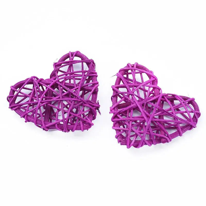 Two vibrant purple woven love heart decorations made from natural twine by DecorBites love heart for weddings and scrapbooking