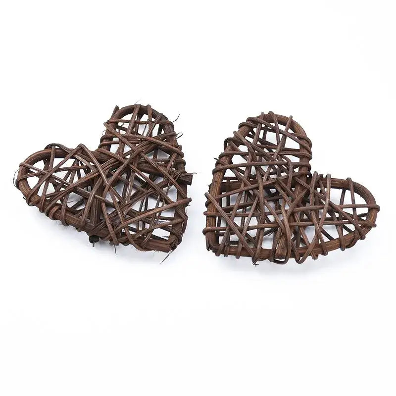 Two rustic brown woven heart-shaped love heart decorations made from natural twigs by DecorBites Love for weddings and valentines