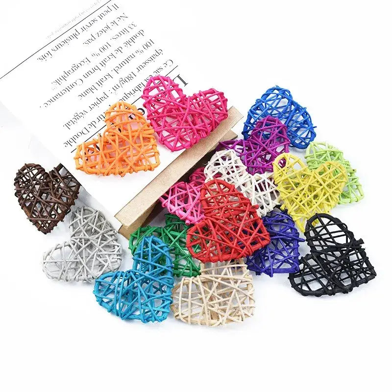 A collection of colorful woven love heart decorations made from natural plant fibers by decorbites love for weddings and scrapbooking