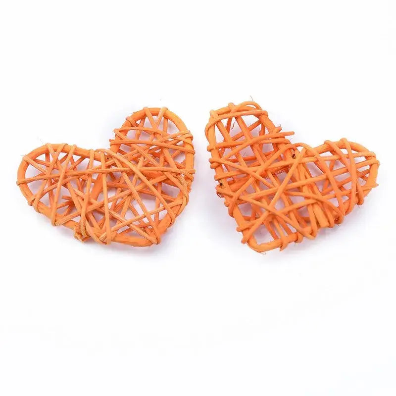 Orange woven heart-shaped decorbites love heart decorations made from natural twigs for wedding and valentines use