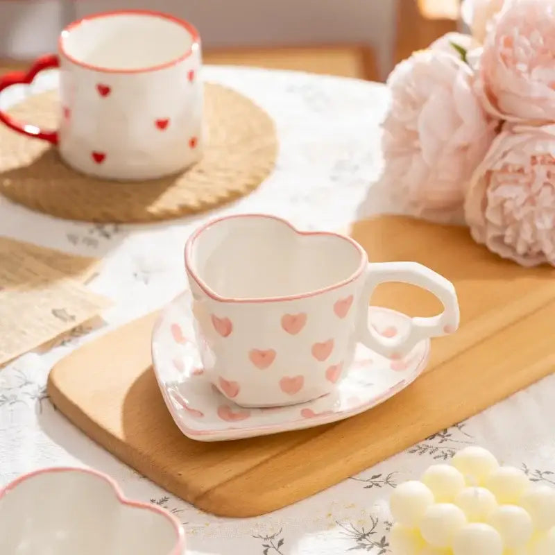 White ceramic heart shaped tea cup with pink polka dots on matching saucer decorbites love heart hand painted mug