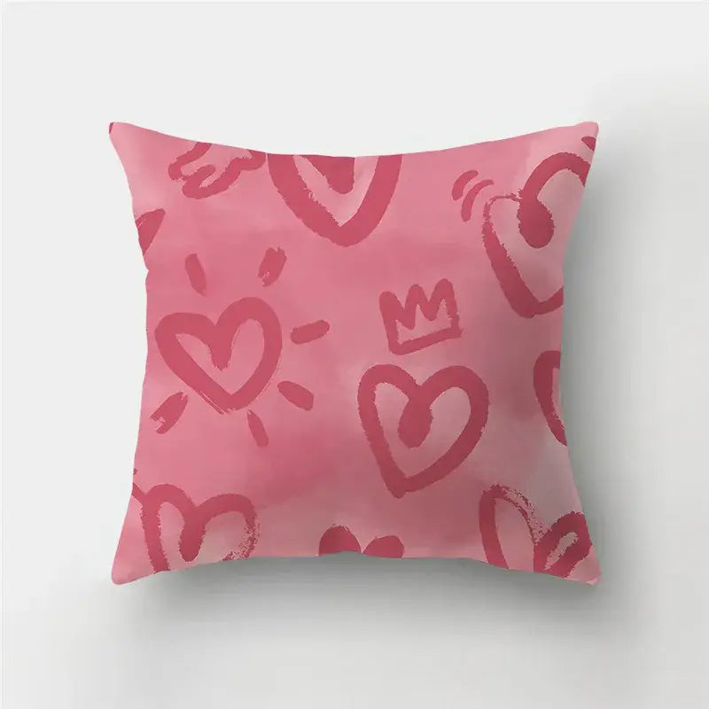 Pink throw pillow cover with playful love heart print and crown pattern in shades of pink for home decor sofa use