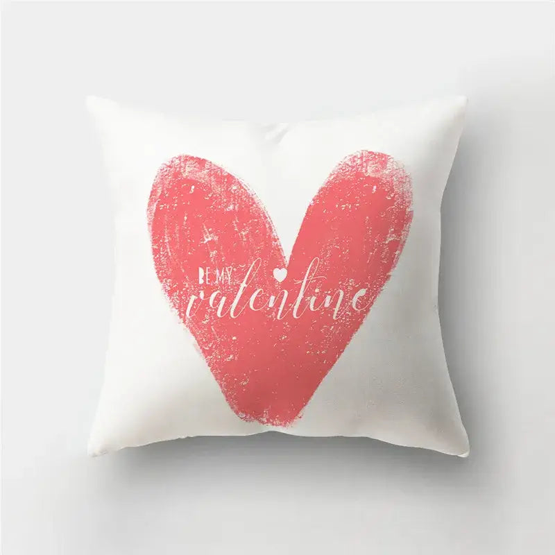 White throw pillow cover with textured coral pink love heart print and be my valentine cursive text for home decor