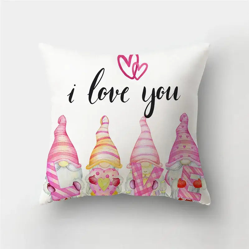 White pillow cover featuring pink-striped gnomes and a love heart print with i love you script for home decor