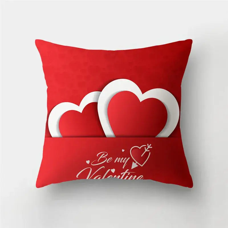 Red throw pillow from decorbites featuring a love heart print and be my valentine script for heart print sofa use