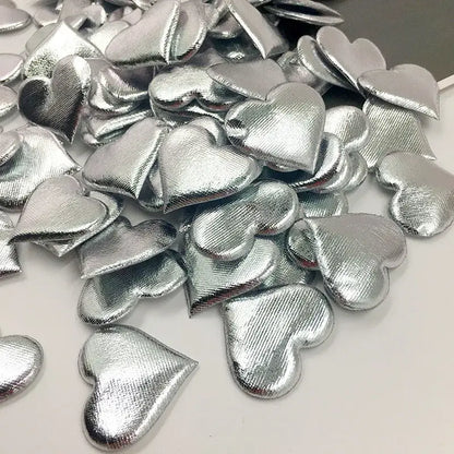 Shiny silver heart-shaped confetti with textured fabric surface from decorbites love petal peach heart wedding bouquet