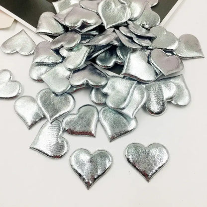 Silver heart-shaped embellishments with textured metallic finish in decorbites love petal peach heart wedding bouquet