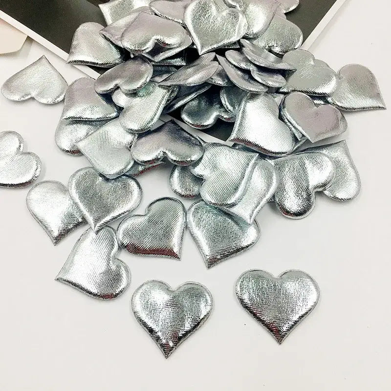 Silver heart-shaped embellishments with textured metallic finish in decorbites love petal peach heart wedding bouquet