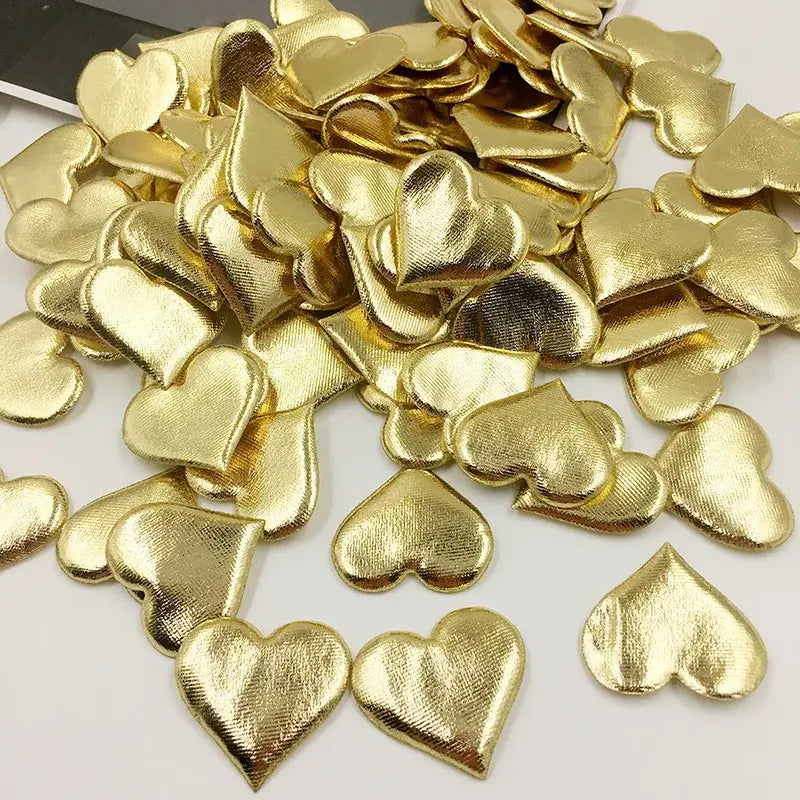 Gold heart-shaped embellishments with textured metallic finish in decorbites love petal peach heart wedding bouquet