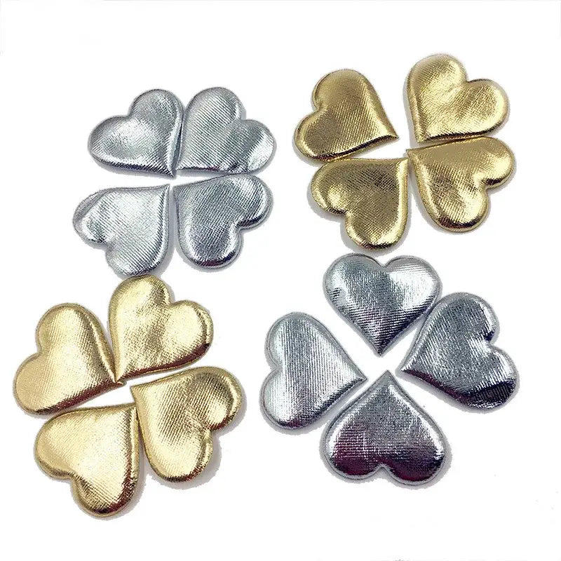 Shiny metallic four leaf clover embellishments in gold and silver finishes on decorbites love petal peach heart bouquet
