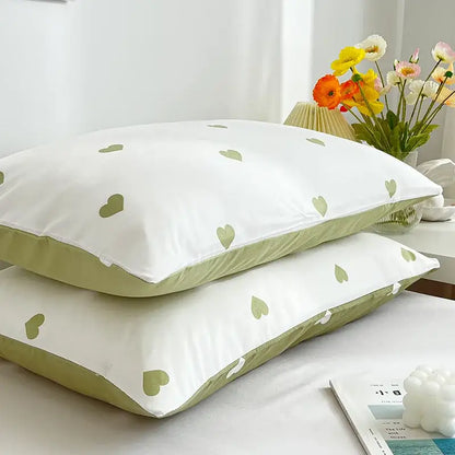 Decorbites love printed pillowcase set features white fabric with light green heart patterns and olive-green piping detail