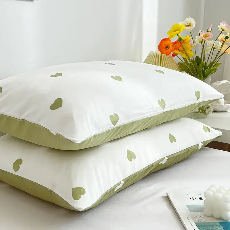 Decorbites love printed pillowcase set features white fabric with light green heart patterns and olive-green piping detail