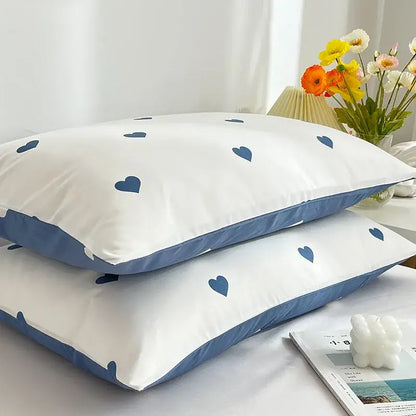 Decorbites love printed pillowcase set features white pillowcases with navy blue heart patterns and matching piping