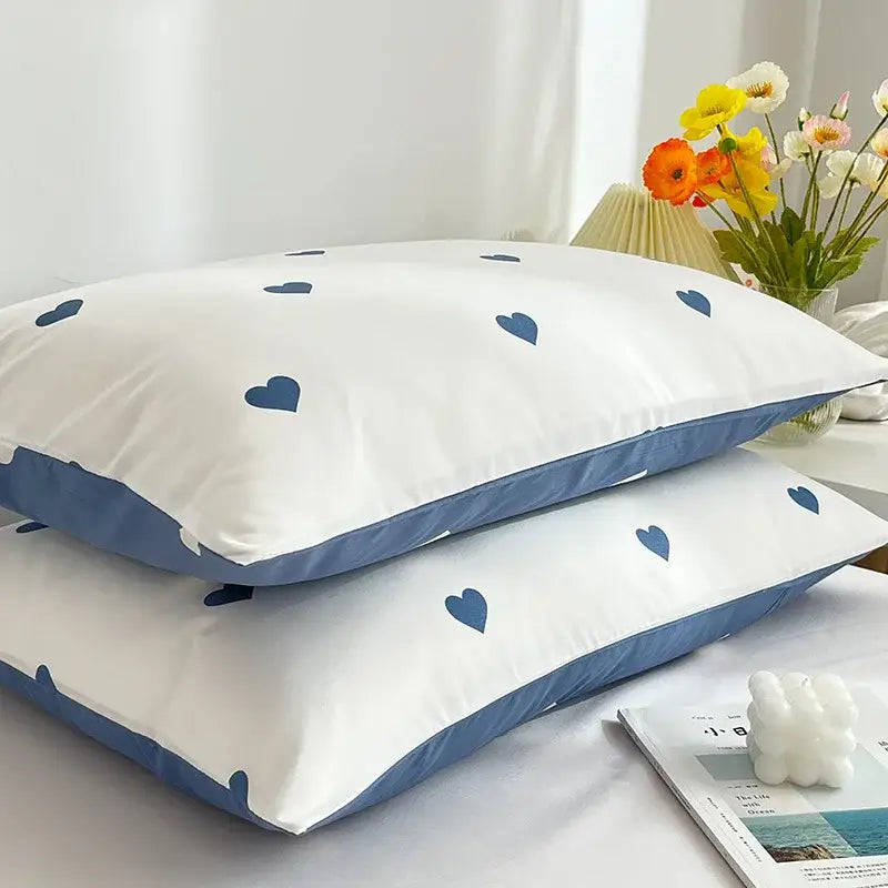 Decorbites love printed pillowcase set features white pillowcases with navy blue heart patterns and matching piping