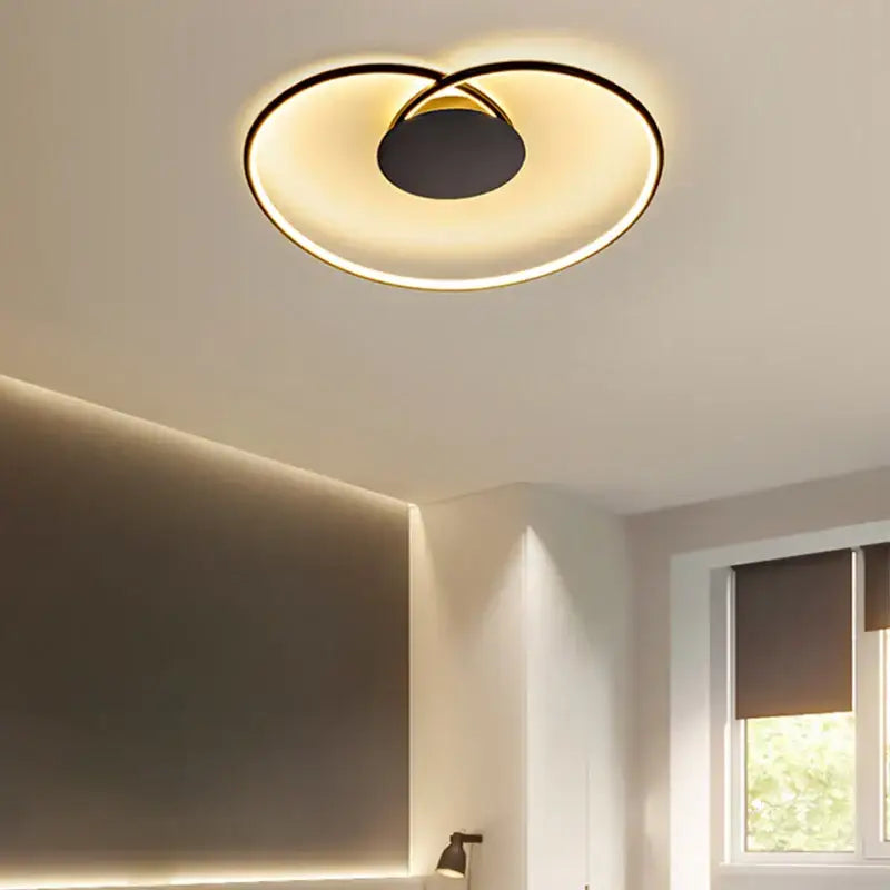 Modern black and gold decorbites love shaped ceiling light with sleek minimalist design for bedroom and living room