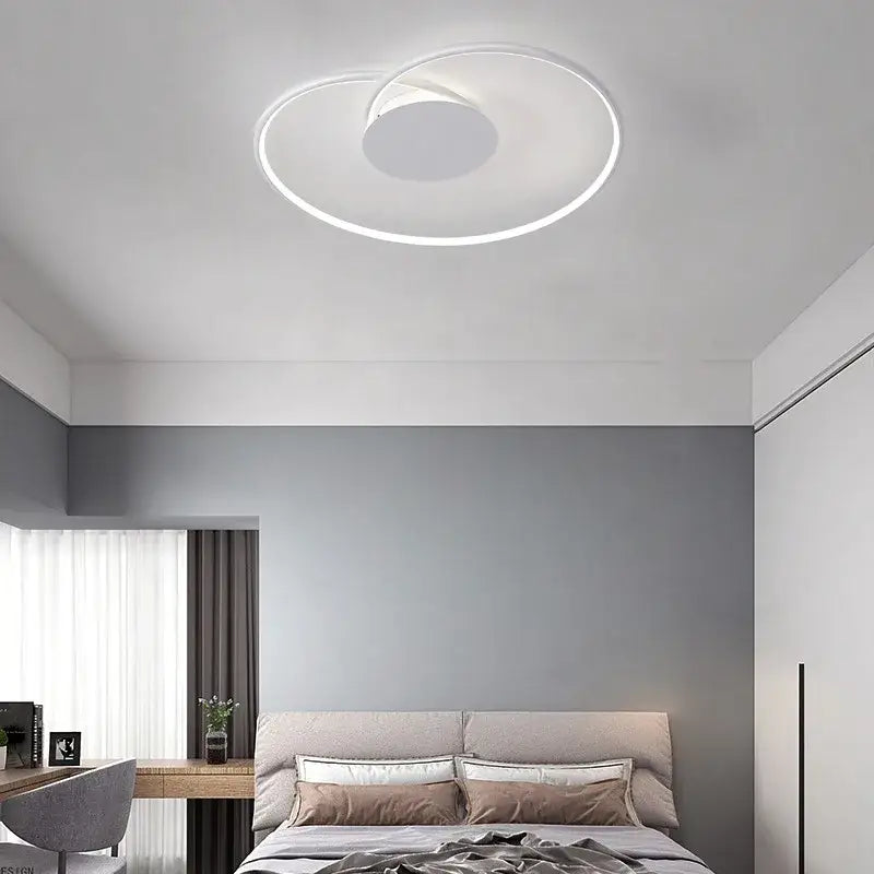 Modern white circular led ceiling light with sleek minimalist design in decorbites love shaped ceiling for bedroom and living room