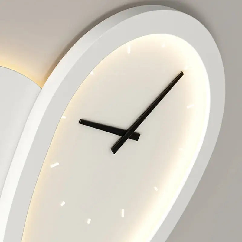 Modern oval decorbites love shaped clock wall lamp with sleek white frame and glowing backlight for indoor bedroom lighting