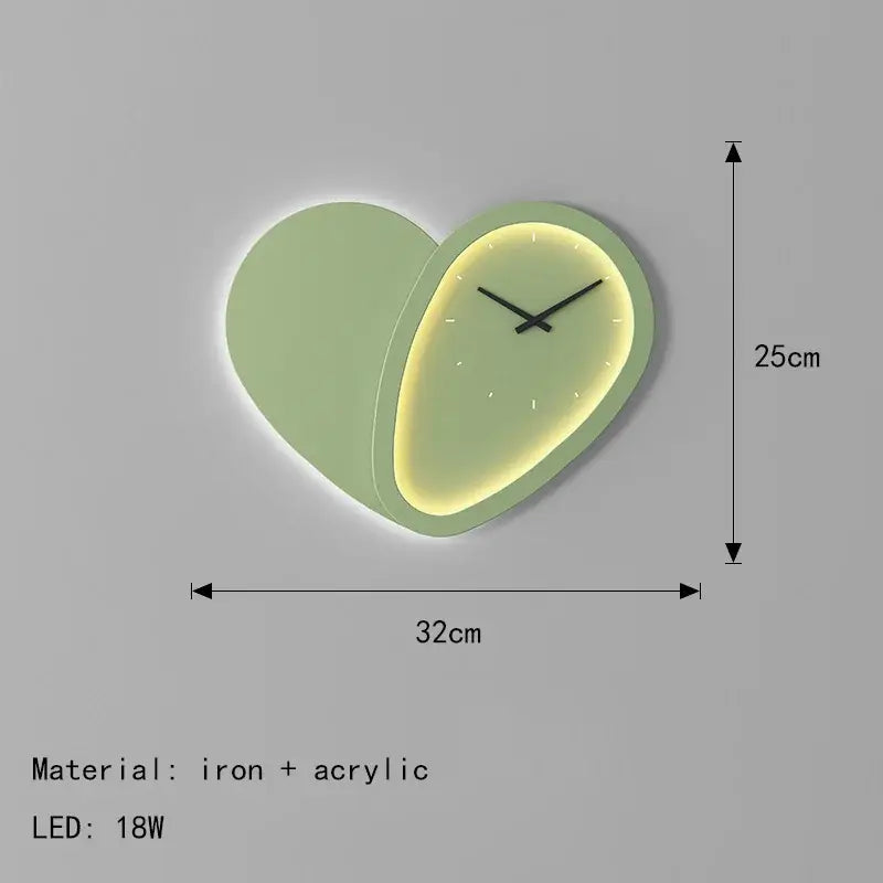 A modern decorbites love shaped wall lamp made of iron and acrylic with soft green frame and illuminated face