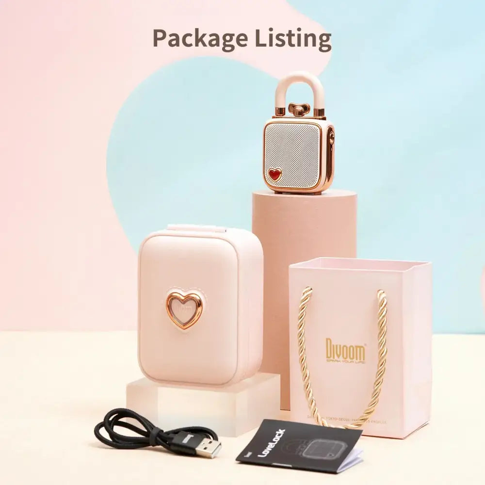 Rose gold heart-shaped DecorBites™ lovelock mini bluetooth speaker with white mesh grille and matching handle