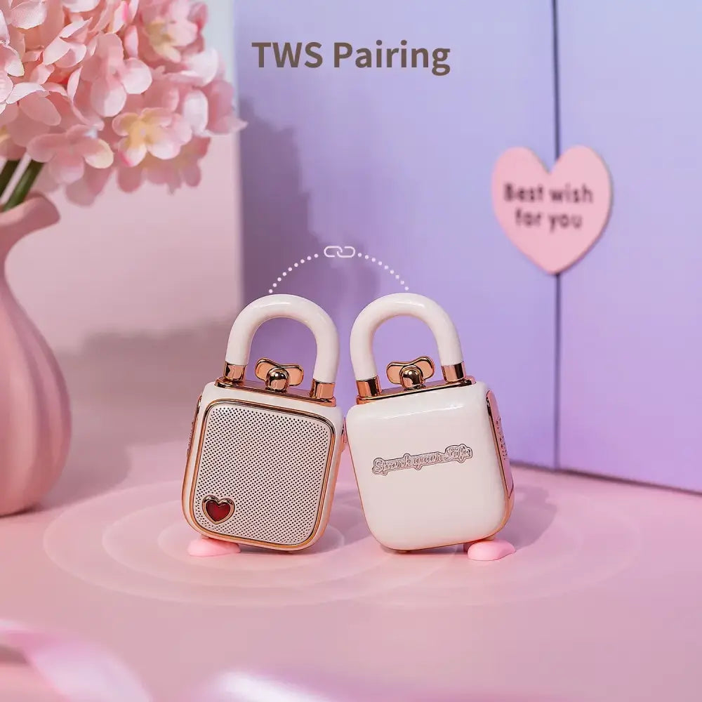 Cream-colored lovelock mini bluetooth earbuds with rose gold accents and heart detail for stylish audio use