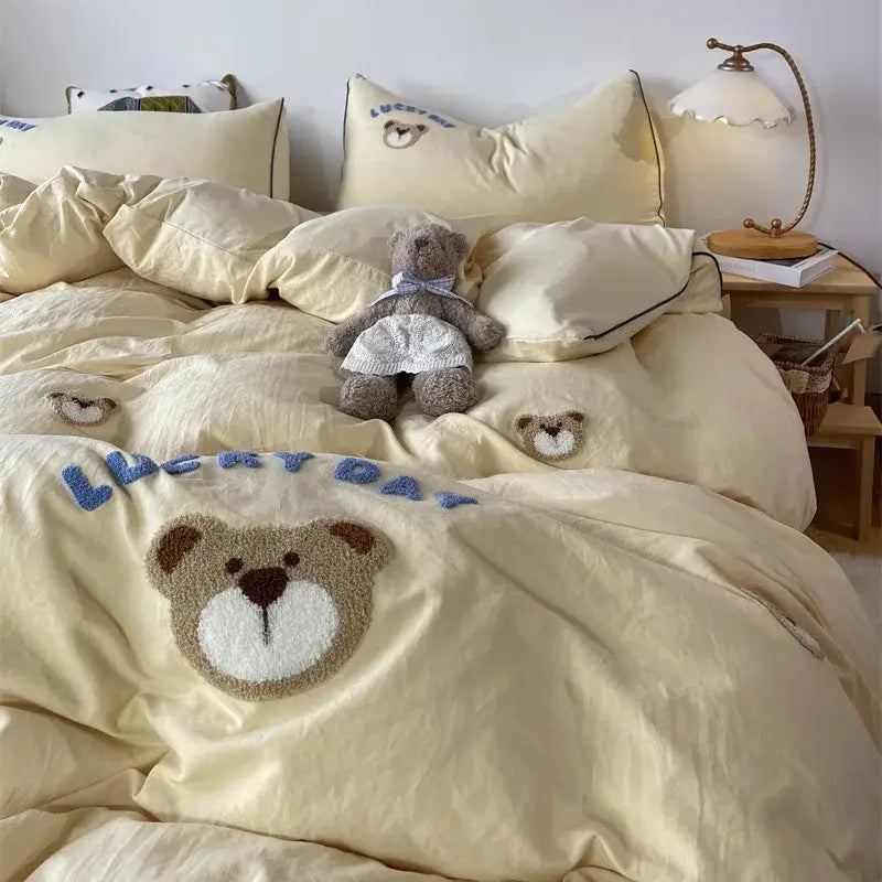 Cream-colored decorbites lovely bear and sheep embroidered bedding set with plush teddy bear appliqué and blue lucky day text