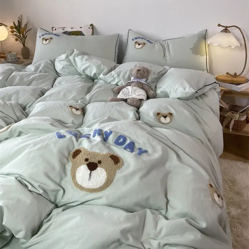 Mint green plush teddy bear-themed embroidered bedding set with happy day lettering from DecorBites™